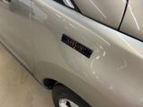 a close up of a car door with a sticker on it