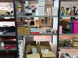 many boxes and boxes on the shelves in the room
