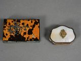 an image of a small box with a shell in it and a small box with a shell in it