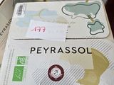 several boxes of peyrassol are stacked on a table