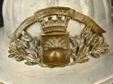 a white fireman ' s hat with a gold crown on it