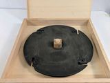 an old record player sitting in a wooden box with a wooden base