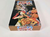 a box of nintendo super street fighter on a white surface
