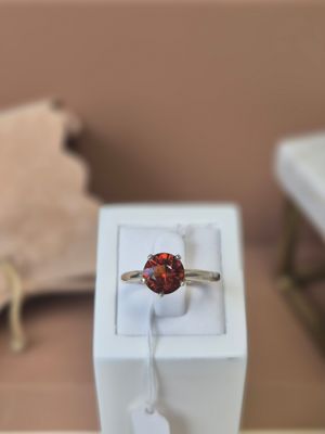 a ring that is sitting in a box on a table