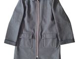 the jacket is blue and has a zipper on the front