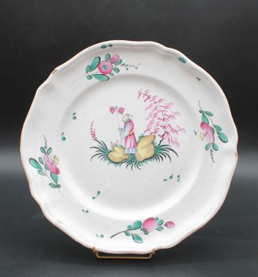 an image of a white plate with pink flowers and birds on it