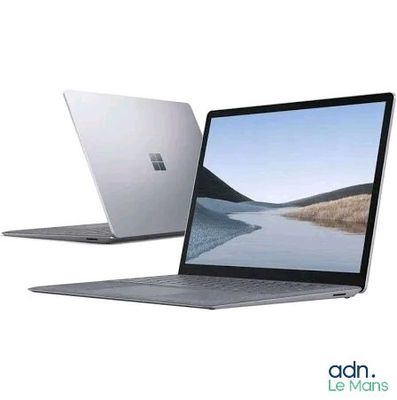 two laptops side by side on a white background with a lake in the background