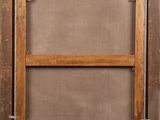 an old wooden frame with a picture hanging on the wall