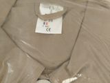 a brown shirt wrapped in plastic and a stuffed animal