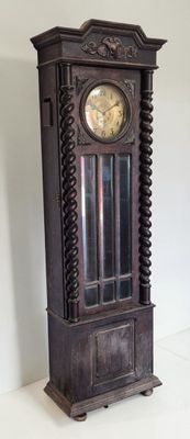 a grandfather clock sitting on the floor in a room