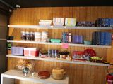 a shelf with many different items on it in a room