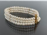 three strand pearl bracelet with gold clasp
