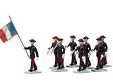 many figurines of men dressed in uniform and holding flags