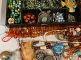 a box full of assorted beads and jewelry on a table
