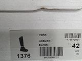 a close up of a box with a pair of boots on it