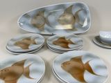 six plates with fish designs on them on a table