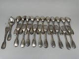 many forks and spoons arranged on a table