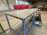 a table that is sitting in the middle of a warehouse