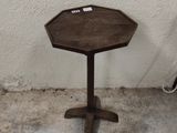 a small table that is sitting on the concrete floor