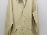 an image of a tan jacket with buttons on the collar