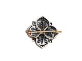 a close up of a black and white broochle on a white background