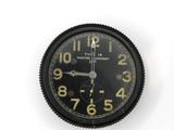 a clock that is on the wall with numbers on it