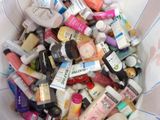 a white bowl filled with lots of different types of skin care products