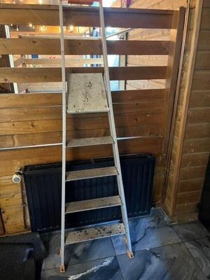 a ladder leaning up against a wall in a room