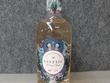 a bottle of ginette sitting on a table