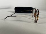 glasses on a white surface with a black case and a pair of glasses