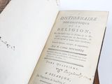 an open book that is sitting on top of a table