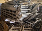 a large pile of metal items in a warehouse