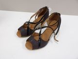 the woman ' s shoes are on a white surface