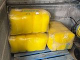 a pallet full of yellow plastic wrapped in plastic
