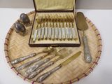 a tray with silverware on it on a table