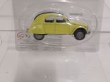a yellow toy car in a clear plastic box