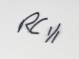a close up of a black and white photo of the word rw written on a piece of paper