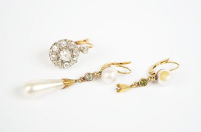 two pairs of earrings and a pearl earring