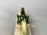 a figurine of a man riding a motorcycle on a board