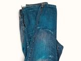 the back of a pair of jeans on a white background
