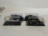 three toy cars that are sitting in a display case