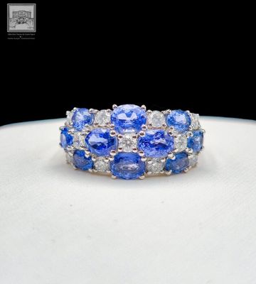 Imposante Bague jonc en or blanc 750°/.(18K), ornée de saphi…