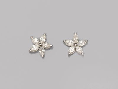 a pair of diamond earrings
