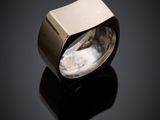 a close up of a ring on a black surface