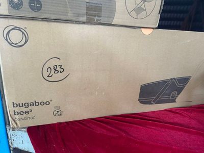 a cardboard box that is sitting on top of a bed