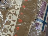 a bag of luggage that is wrapped up and ready to be packed