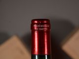 a bottle of wine that is sitting on a table