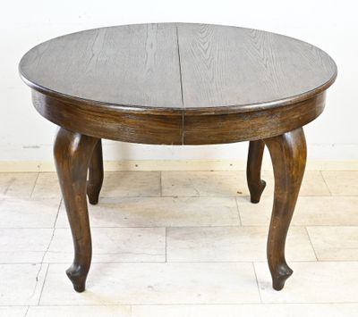 une photo d'une table en bois avec deux rallonges sur le plateau