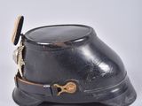 a black hat with a gold buckle on it and a black hat with a gold buckle on it