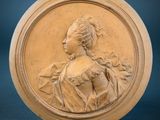 an image of a carved plaque of a woman